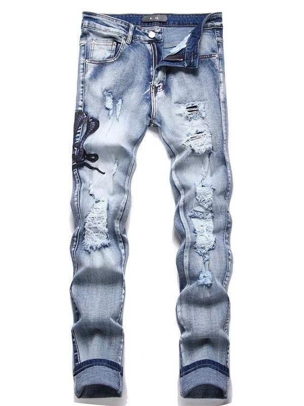 Pantalones AMIRI Snake Embroidery Azul Claro Pantalones AMIRI Snake Embroidery Azul Claro